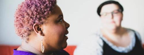 Photo of two women talking